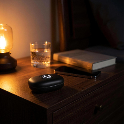 SilentEar charging case with LED battery display glowing on a nightstand